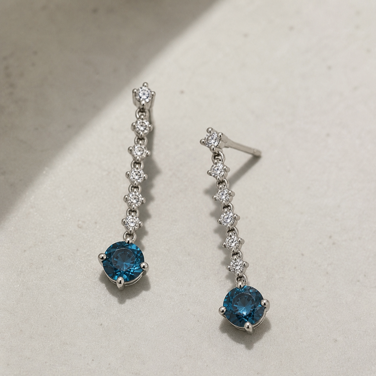 Graduated Blue Diamond Tennis Earrings blue diamond