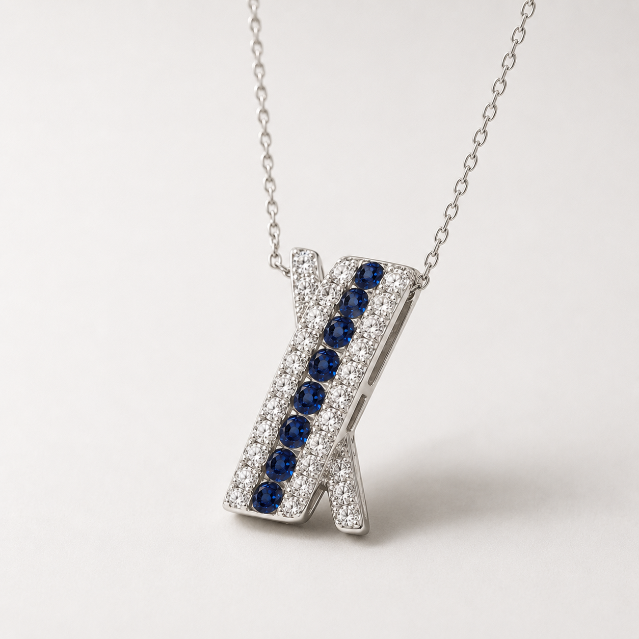 Diamond & Sapphire Crossover Pendant